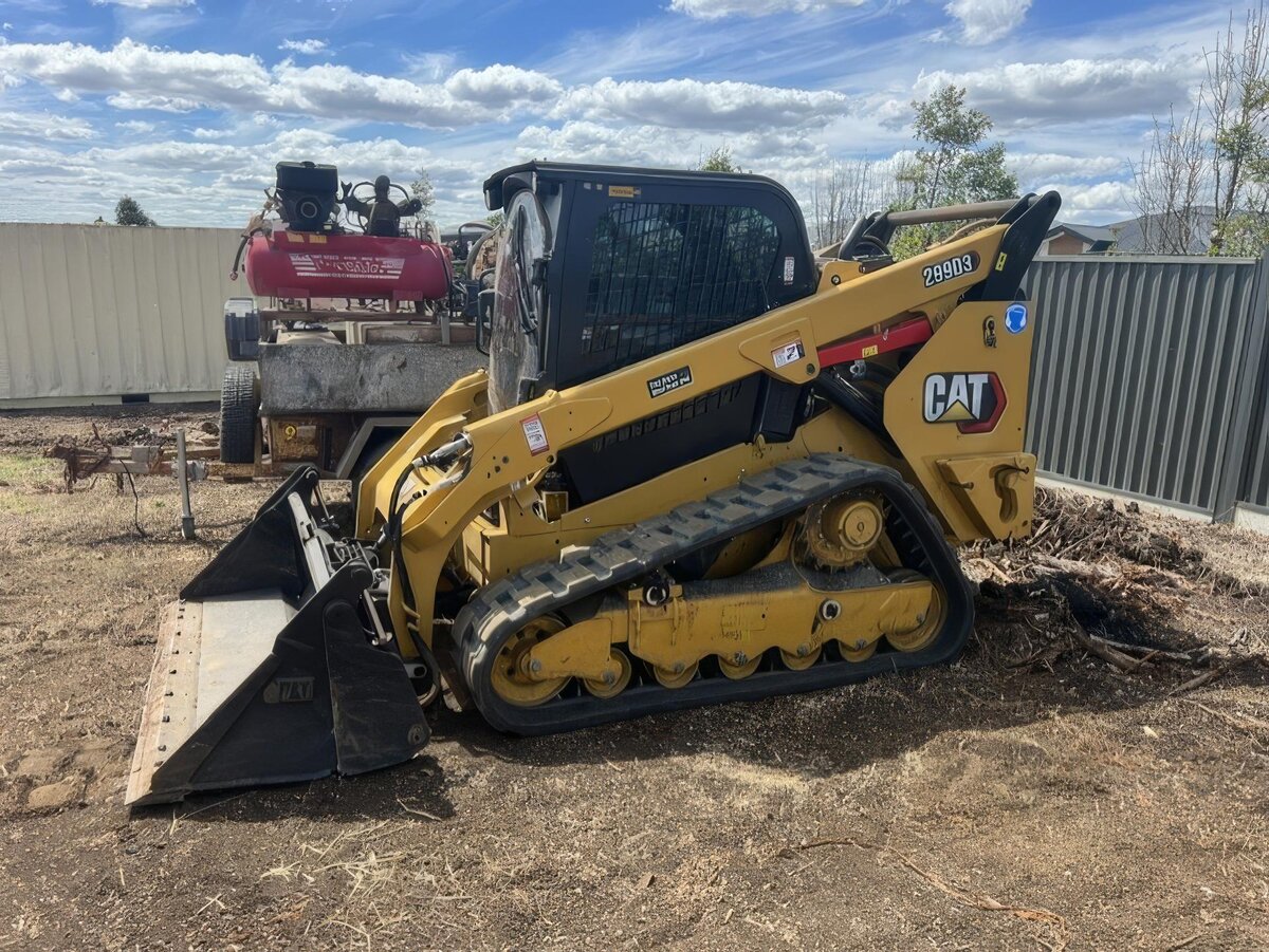 Skid steer on worksite